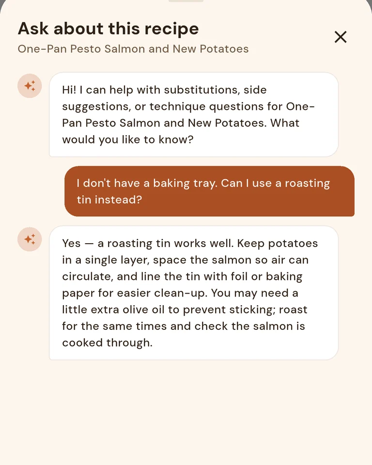 Asking about a salmon recipe: “Can I use a roasting tin instead?” The assistant says yes and explains how.
